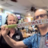 Marcella Knight of Koco’s Pub gives Nestor a birthday gift and another kind of cake that isn’t crab
